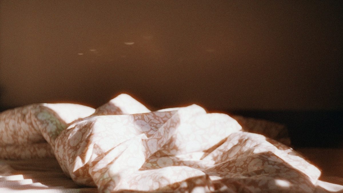 Late-morning sunlight falling across the floor beside a window